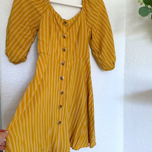 Gently used balloon sleeve mustard colored mini dress with pin stripes. - Picture 2 of 3